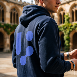 Men's navy blue hoodie worn, the large logo printed on the back — alternate photo